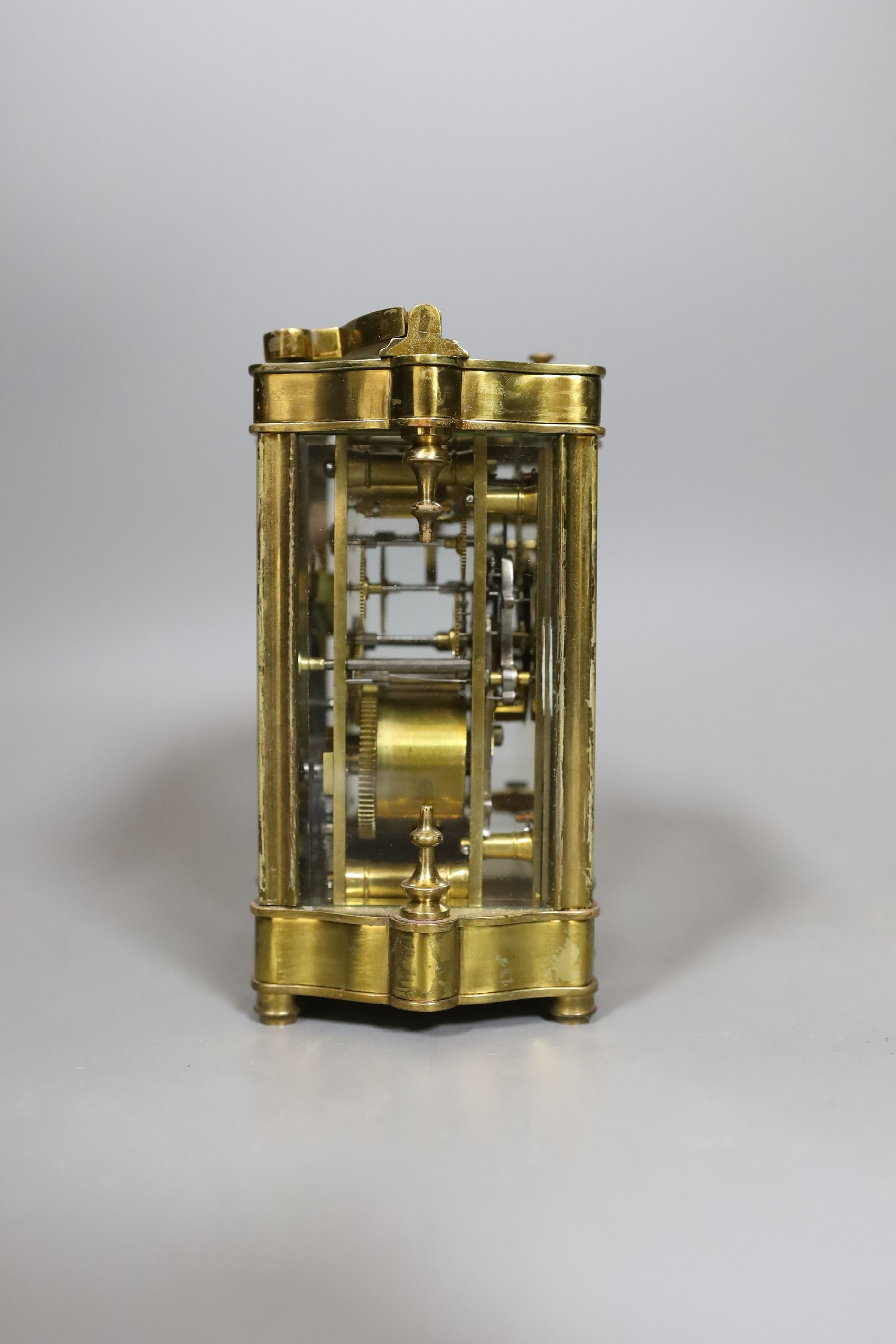 A cased brass repeating carriage clock, in case, 12 cms high.